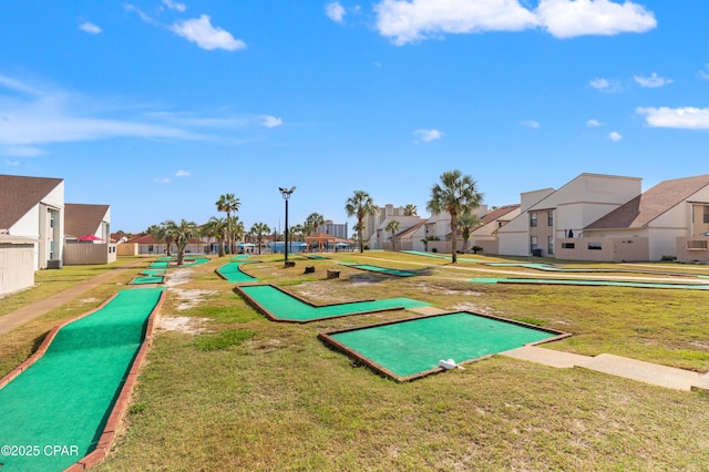 17462 Front Beach Rd Unit 24C, Panama City Beach, FL 32413 - surrounding community with a residential view, an area to practice putting, and a lawn