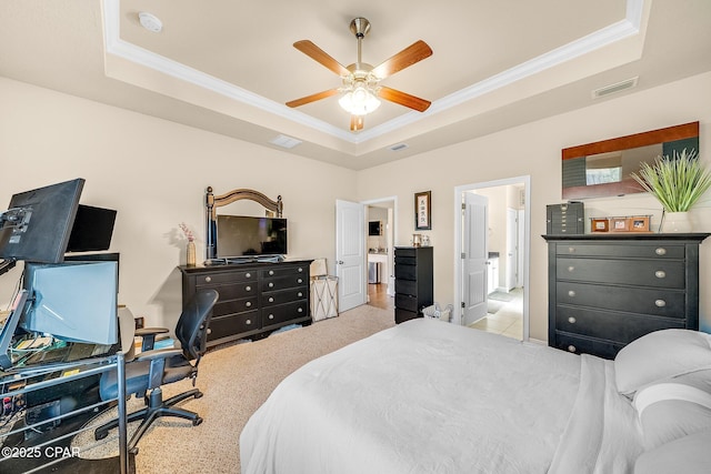 carpeted bedroom with a raised ceiling, ornamental molding, and visible vents