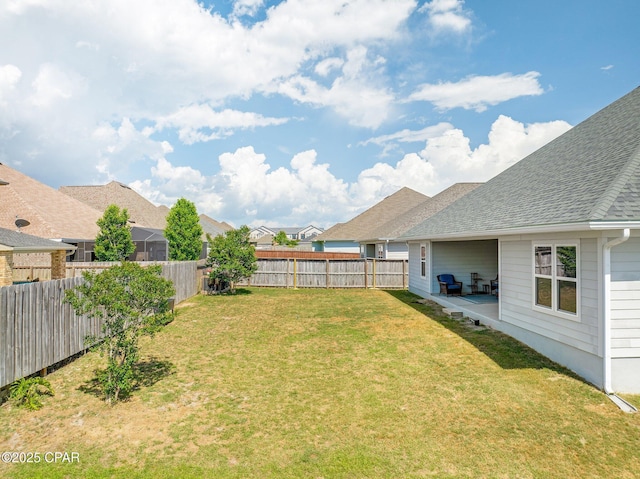 view of yard with a fenced backyard
