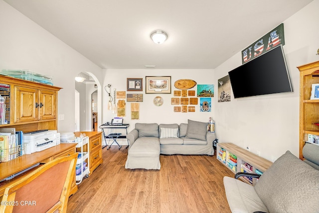 111 Water Lilly Cv, Panama City, FL 32404 - living area featuring arched walkways and light wood finished floors