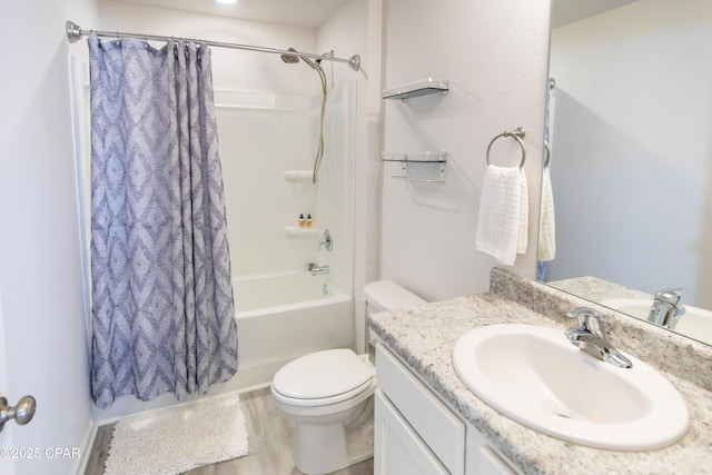 full bath featuring vanity, shower / bath combination with curtain, and toilet