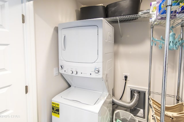 washroom with stacked washer / dryer