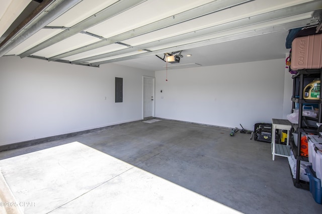 garage featuring a garage door opener and electric panel