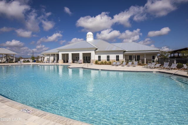 pool with fence and a patio