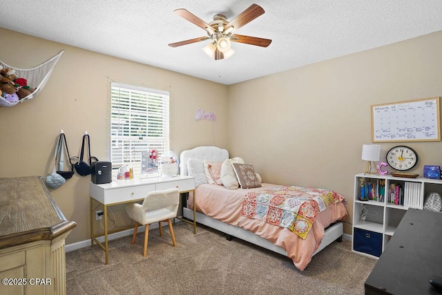 bedroom with a textured ceiling, baseboards, and carpet floors