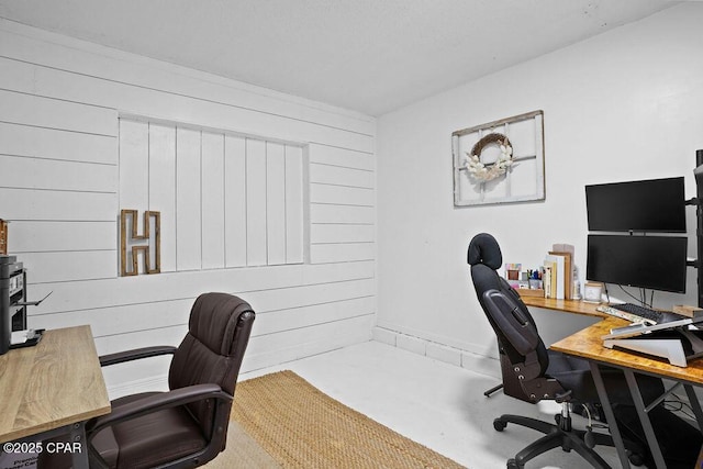 home office featuring wood walls