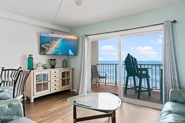 8743 Thomas Dr Unit 809, Panama City Beach, FL 32408 - living room with wood finished floors and a textured ceiling