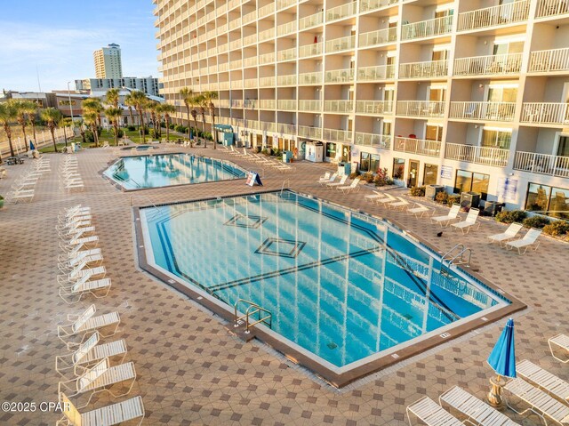 8743 Thomas Dr Unit 809, Panama City Beach, FL 32408 - community pool featuring a patio