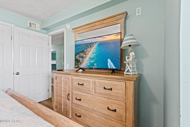8743 Thomas Dr Unit 809, Panama City Beach, FL 32408 - detailed view of a textured ceiling and wood finished floors