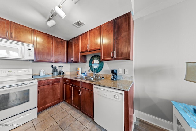 9860 S Thomas Dr Unit 1018, Panama City Beach, FL 32408 - kitchen with white appliances, a sink, light tile patterned floors, and track lighting