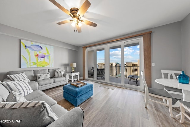 9860 S Thomas Dr Unit 1018, Panama City Beach, FL 32408 - living area featuring wood finished floors and a ceiling fan
