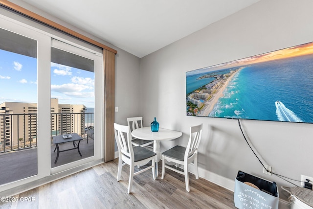 9860 S Thomas Dr Unit 1018, Panama City Beach, FL 32408 - dining room with wood finished floors and baseboards