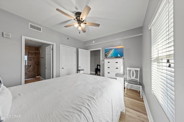 9860 S Thomas Dr Unit 1018, Panama City Beach, FL 32408 - bedroom with light wood-type flooring, baseboards, and a ceiling fan