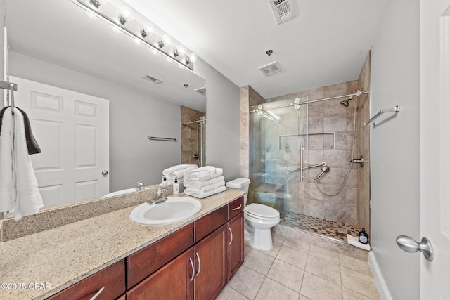 9860 S Thomas Dr Unit 1018, Panama City Beach, FL 32408 - bathroom featuring vanity, a shower stall, tile patterned flooring, and toilet