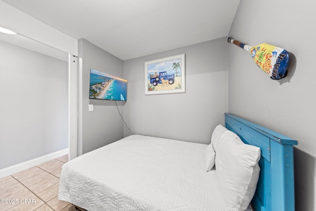 9860 S Thomas Dr Unit 1018, Panama City Beach, FL 32408 - tiled bedroom featuring baseboards