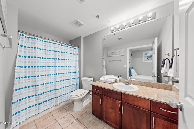 9860 S Thomas Dr Unit 1018, Panama City Beach, FL 32408 - bathroom with vanity, tile patterned flooring, ensuite bath, toilet, and a shower with shower curtain