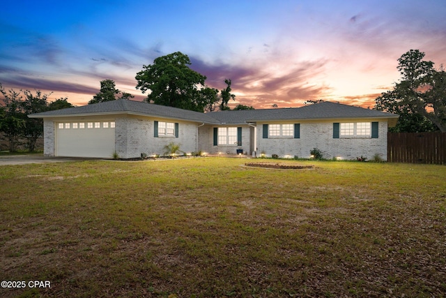 629 Old Forest Way, Panama City, FL 32404 - ranch-style house with an attached garage, brick siding, and driveway