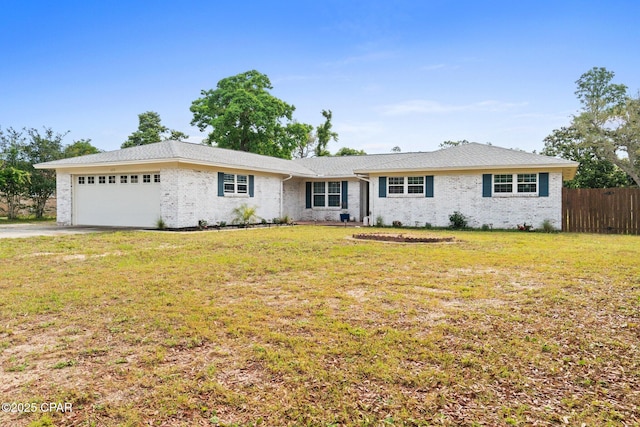 629 Old Forest Way, Panama City, FL 32404 - ranch-style house featuring an attached garage, brick siding, and driveway