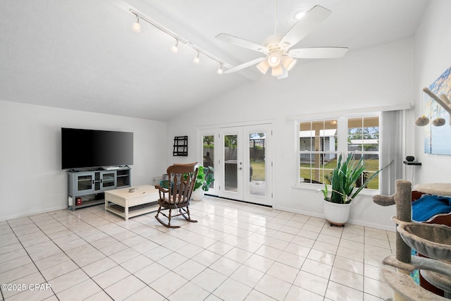 629 Old Forest Way, Panama City, FL 32404 - living area featuring track lighting, french doors, light tile patterned floors, a ceiling fan, and high vaulted ceiling