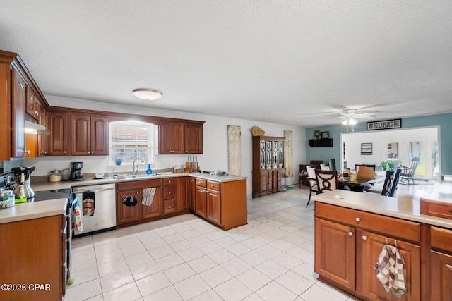 629 Old Forest Way, Panama City, FL 32404 - kitchen with appliances with stainless steel finishes, a ceiling fan, light countertops, a textured ceiling, and under cabinet range hood