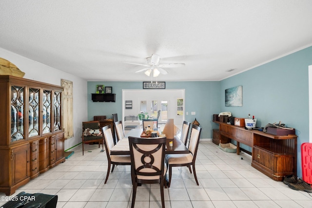 629 Old Forest Way, Panama City, FL 32404 - dining space with ceiling fan, light tile patterned floors, and crown molding