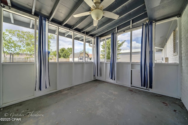 unfurnished sunroom with plenty of natural light and ceiling fan