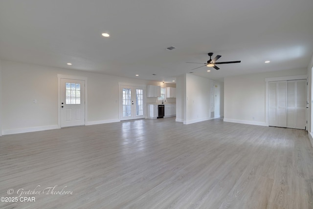 unfurnished living room featuring recessed lighting, baseboards, visible vents, and a ceiling fan