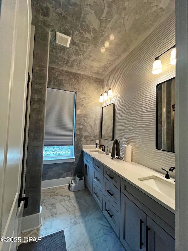 3639 Preserve Blvd, Panama City Beach, FL 32408 - full bathroom with a sink, visible vents, double vanity, and marble finish floor
