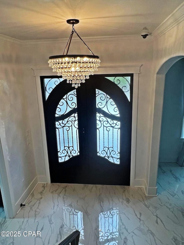 3639 Preserve Blvd, Panama City Beach, FL 32408 - entrance foyer with arched walkways, a notable chandelier, french doors, and marble finish floor