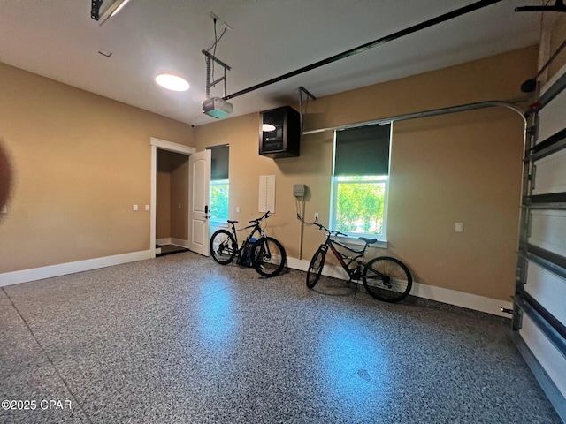 3639 Preserve Blvd, Panama City Beach, FL 32408 - garage featuring baseboards and a garage door opener