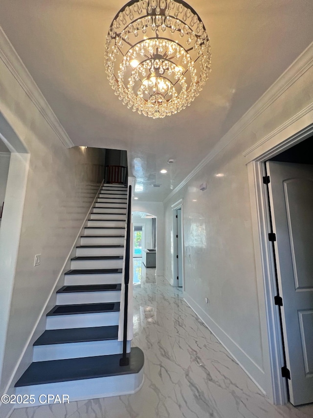 3639 Preserve Blvd, Panama City Beach, FL 32408 - staircase featuring baseboards, ornamental molding, marble finish floor, and a chandelier