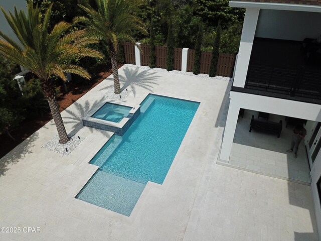 3639 Preserve Blvd, Panama City Beach, FL 32408 - view of swimming pool featuring fence, a pool with connected hot tub, and a patio area