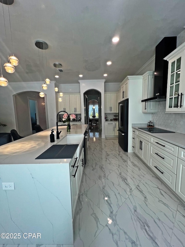 3639 Preserve Blvd, Panama City Beach, FL 32408 - kitchen with arched walkways, black appliances, recessed lighting, and marble finish floor