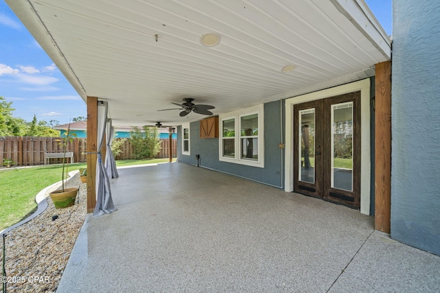 view of patio / terrace with fence and ceiling fan