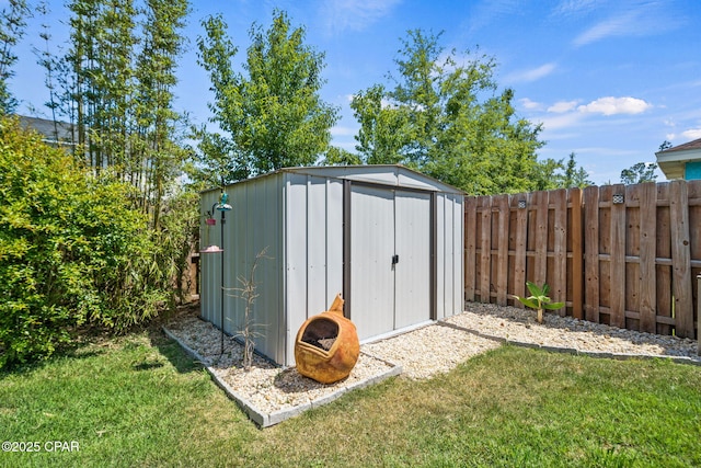 view of shed featuring a fenced backyard