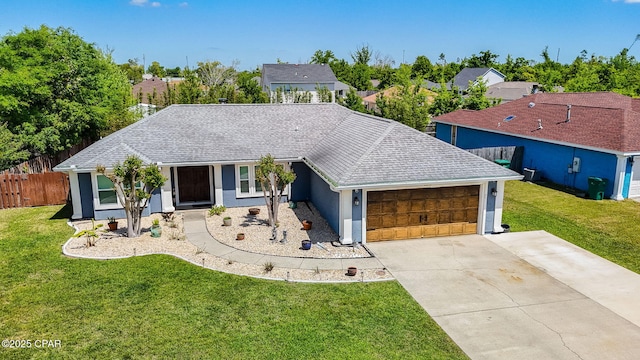 single story home with fence, an attached garage, driveway, and a front lawn