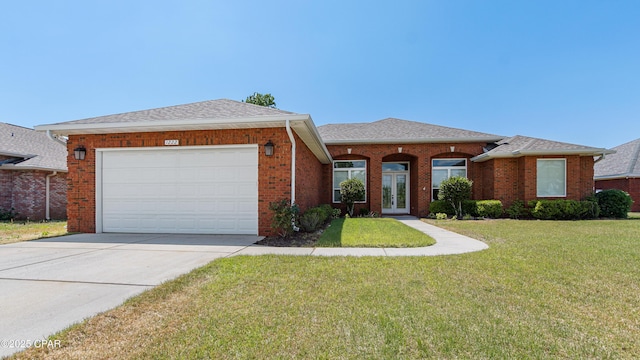 1222 Huntington Ridge Rd, Lynn Haven, FL 32444 - ranch-style home featuring a front lawn, french doors, a shingled roof, an attached garage, and driveway