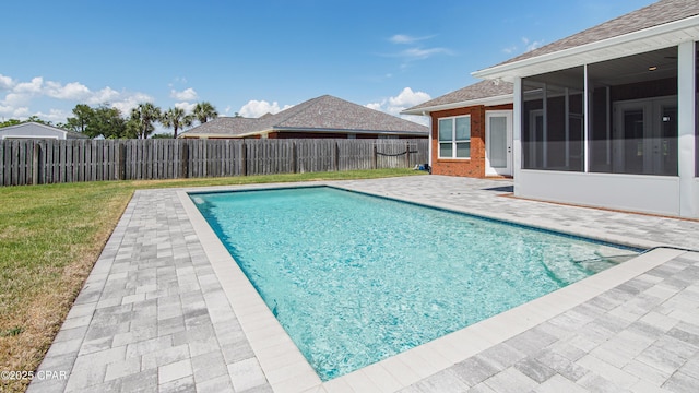 1222 Huntington Ridge Rd, Lynn Haven, FL 32444 - view of pool featuring a fenced backyard, a sunroom, a fenced in pool, a patio area, and a yard