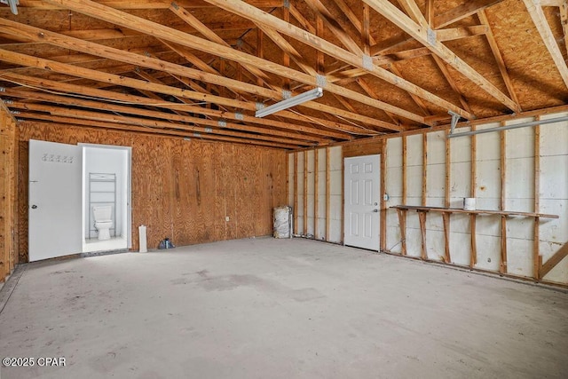 misc room with a garage