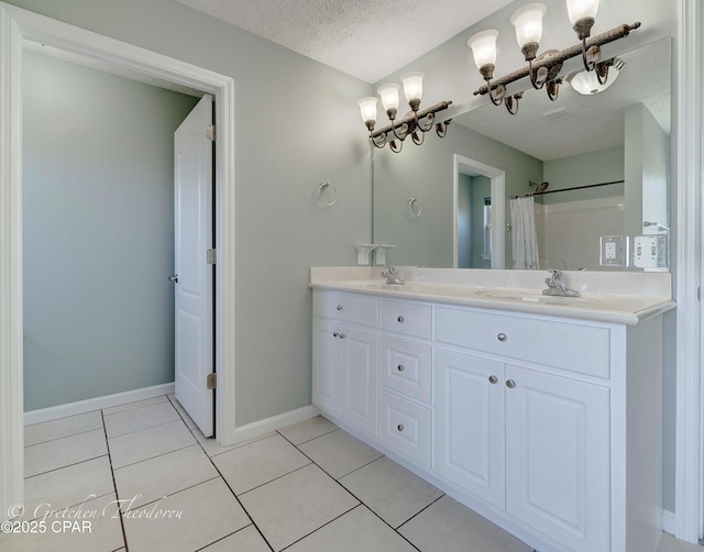 4704 Shannon Ln, Panama City, FL 32404 - full bath featuring double vanity, baseboards, a textured ceiling, tile patterned floors, and a shower with curtain