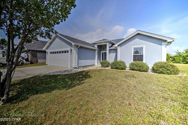 4704 Shannon Ln, Panama City, FL 32404 - single story home featuring an attached garage, stucco siding, driveway, and a front yard