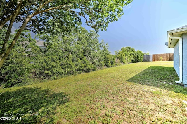 view of yard with fence