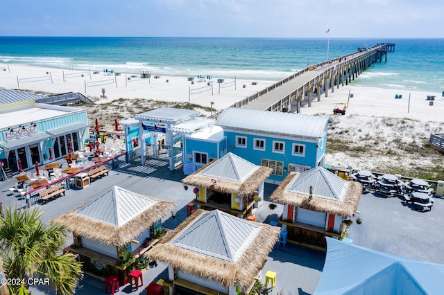 aerial view featuring a view of the beach and a water view