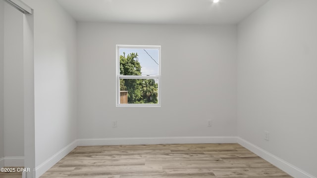 212 N Cove Blvd, Panama City, FL 32401 - spare room with baseboards and light wood-style flooring