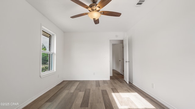 325 Bell Cir, Lynn Haven, FL 32444 - empty room featuring wood finished floors, baseboards, and a ceiling fan