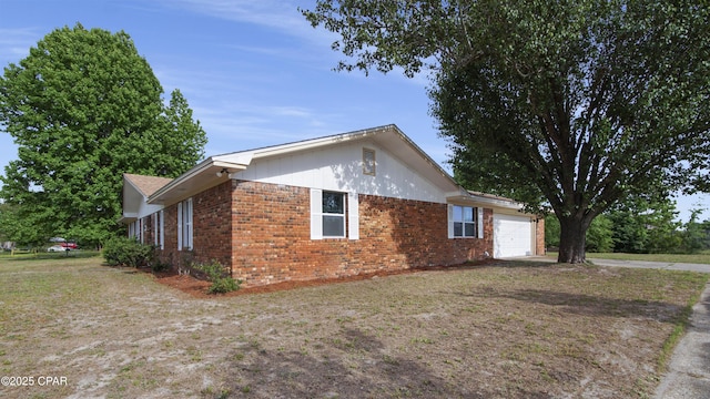 325 Bell Cir, Lynn Haven, FL 32444 - view of side of property featuring an attached garage and brick siding