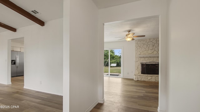 325 Bell Cir, Lynn Haven, FL 32444 - corridor featuring wood finished floors, beam ceiling, and baseboards