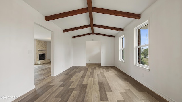325 Bell Cir, Lynn Haven, FL 32444 - unfurnished living room featuring wood finished floors, baseboards, and a stone fireplace