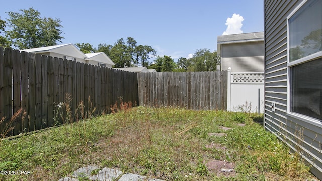 view of yard with a fenced backyard