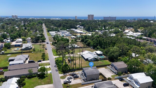 birds eye view of property with a water view and a residential view